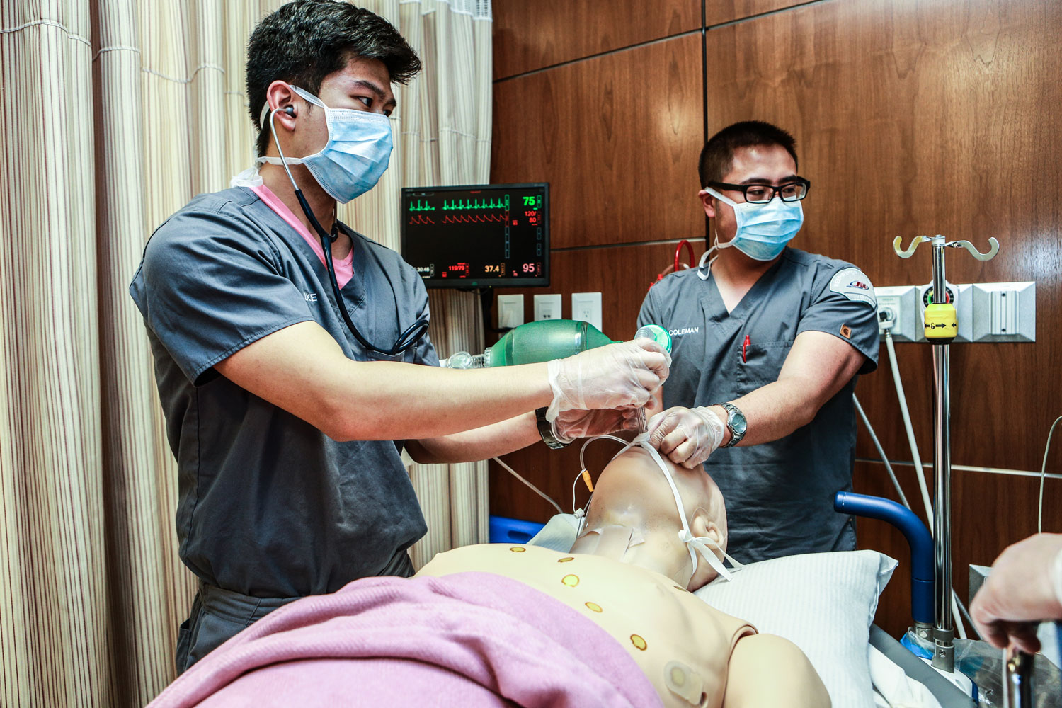 two male students with manikin