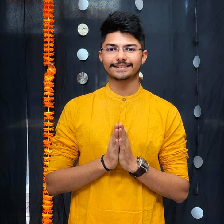 arth smiling with prayer hands