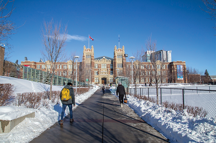 students walking towards heritage hall