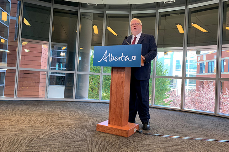 SAIT President and CEO Dr. David Ross speaks while standing at a podium