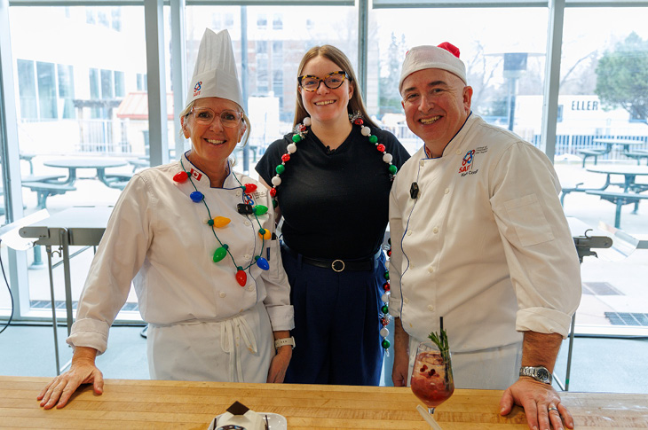 Three SAIT instructors wearing Christmas decor