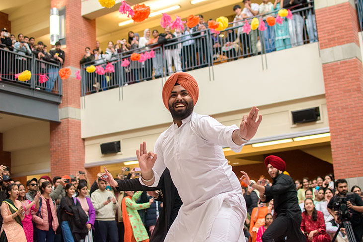man dancing at Diwali celebration in Irene Lewis Atrium 