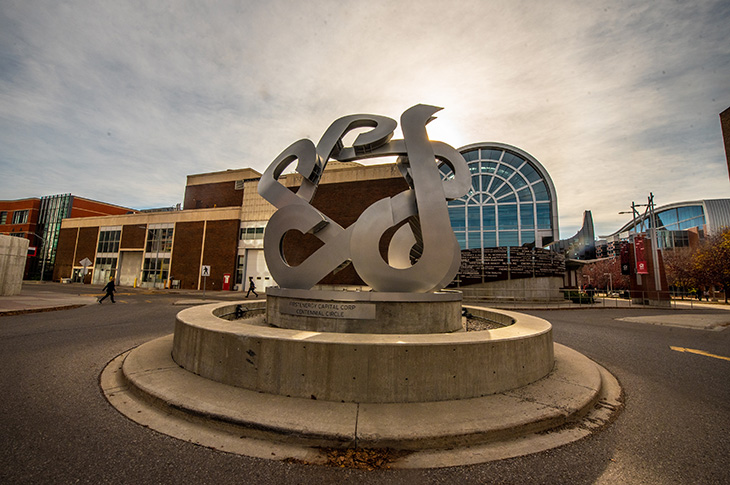 SAIT Catalyst sculpture with sun in the background