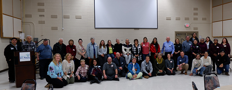 Group photo of attendees at a summit.