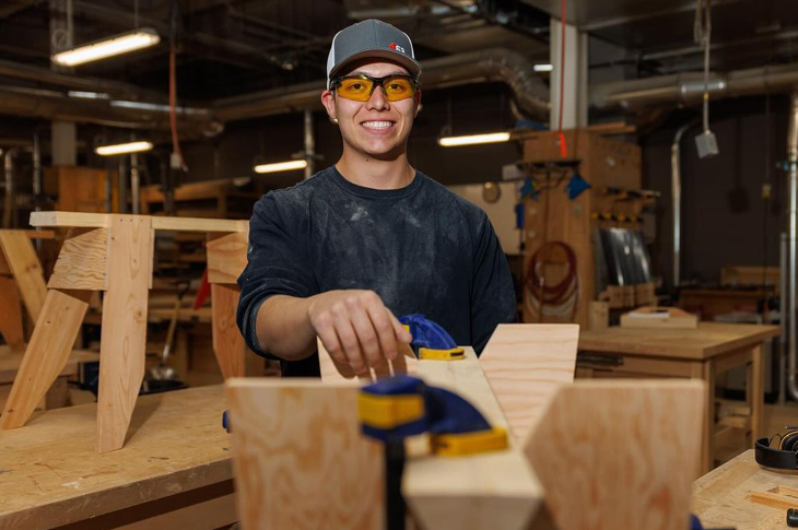 A student in a wood working lab