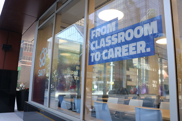 outside SAIT Down with window saying from classroom to career