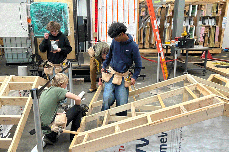 Students put their skills to the test as they construct a home office shed. 