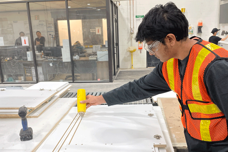 A student gets to try some hands-on learning at a visit to one of the manufacturers. 