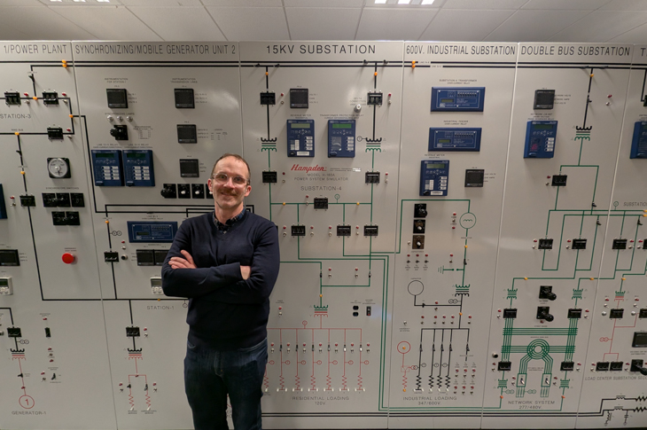 Darko Stelkic, Academic Chair, MacPhail School of Energy stands by a custom-built unit simulating Alberta’s grid. The simulator gives students the chance to test synchronizing, transmitting and distributing electricity.
