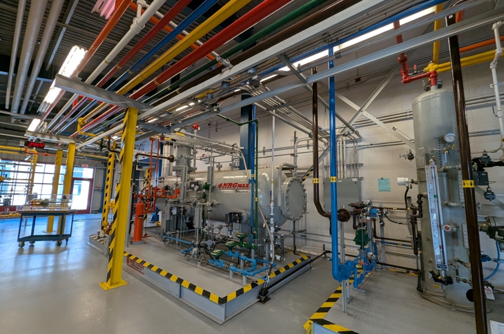 Colour-coded pipes give students a visual of how the oil and gas emulsion is separated into its components.