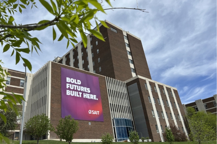 A large promotional banner on a building featuring the text "BOLD FUTURES BUILT HERE"