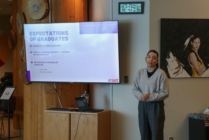 Tahner giving a presentation at an information session