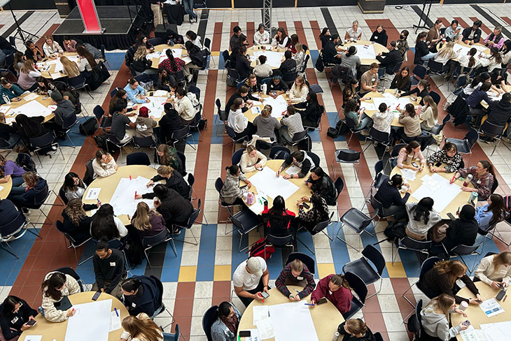 overhead view of students at tables in the Irene Lewis Atrium