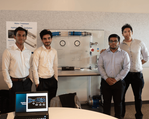 students posing with their capstone project