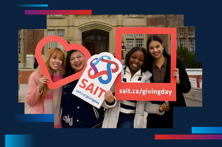 group of women hoding up signs promoting Giving Day