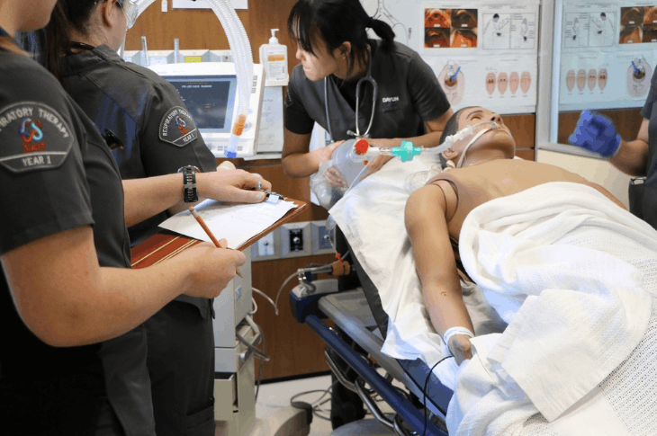 First-year Respiratory Therapy students diagnose and treat a manikin in a high-fidelity simulation.