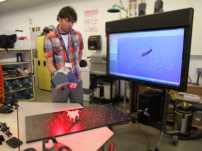 Employee uses 3D printing technology.