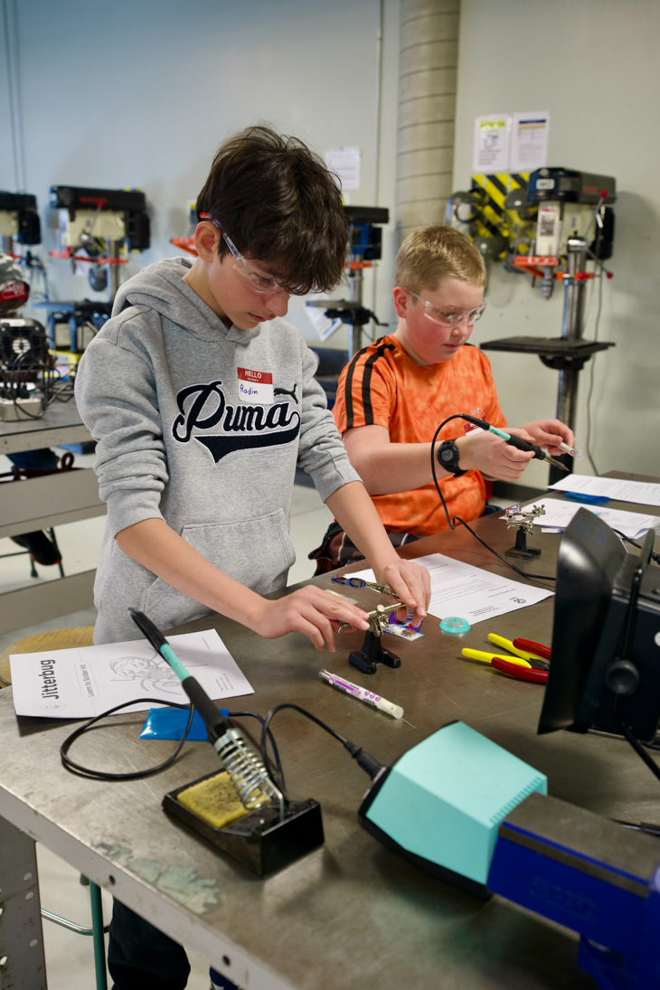 Two students work at an avionics station at the Art Smith Aero Centre.