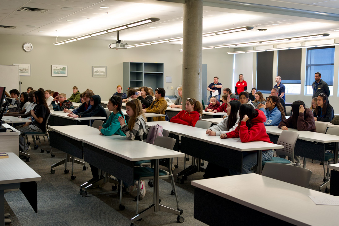 A classroom of junior high students at an aviation event.