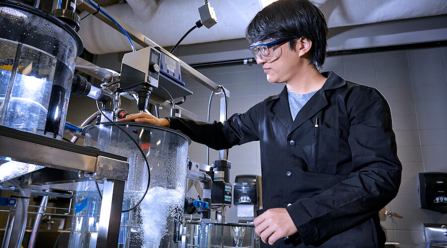 Student using a water tank