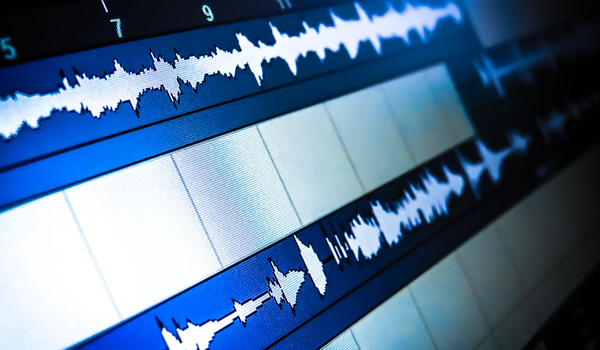 Close-up of audio waveform displays in a digital audio workstation, illustrating sound editing and mixing processes.