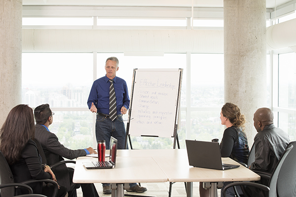 a guy presenting to a group of people