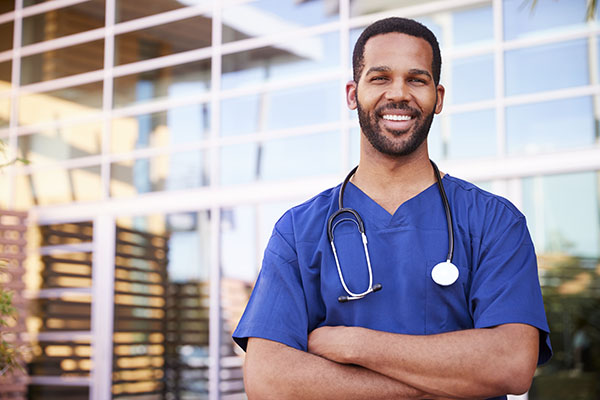 a guy crossing his arms with a stethoscope around his neck
