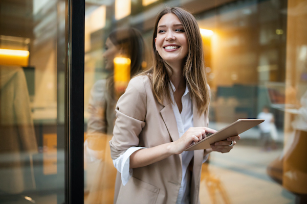 A woman holding an ipad