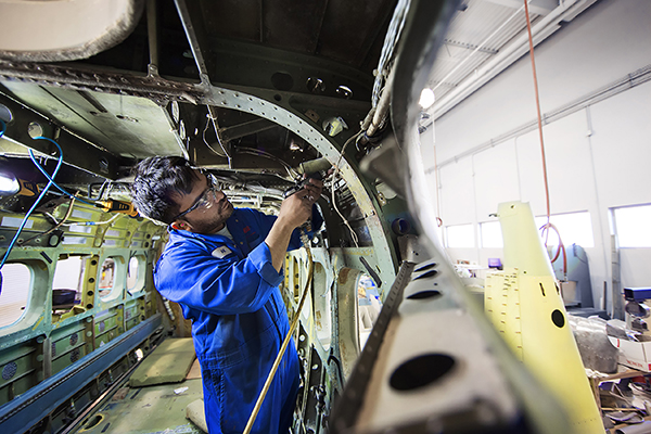 A student working on an aircraft