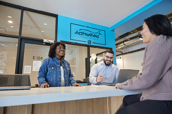 People in a travel agency desk