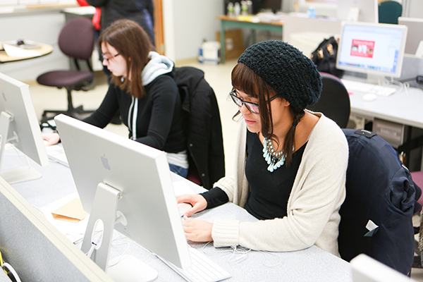 Students working on computers in a classroom