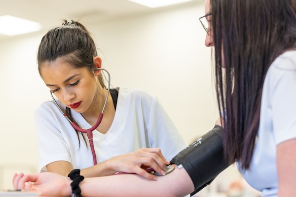 A student learning about the health and medical professions at SAIT