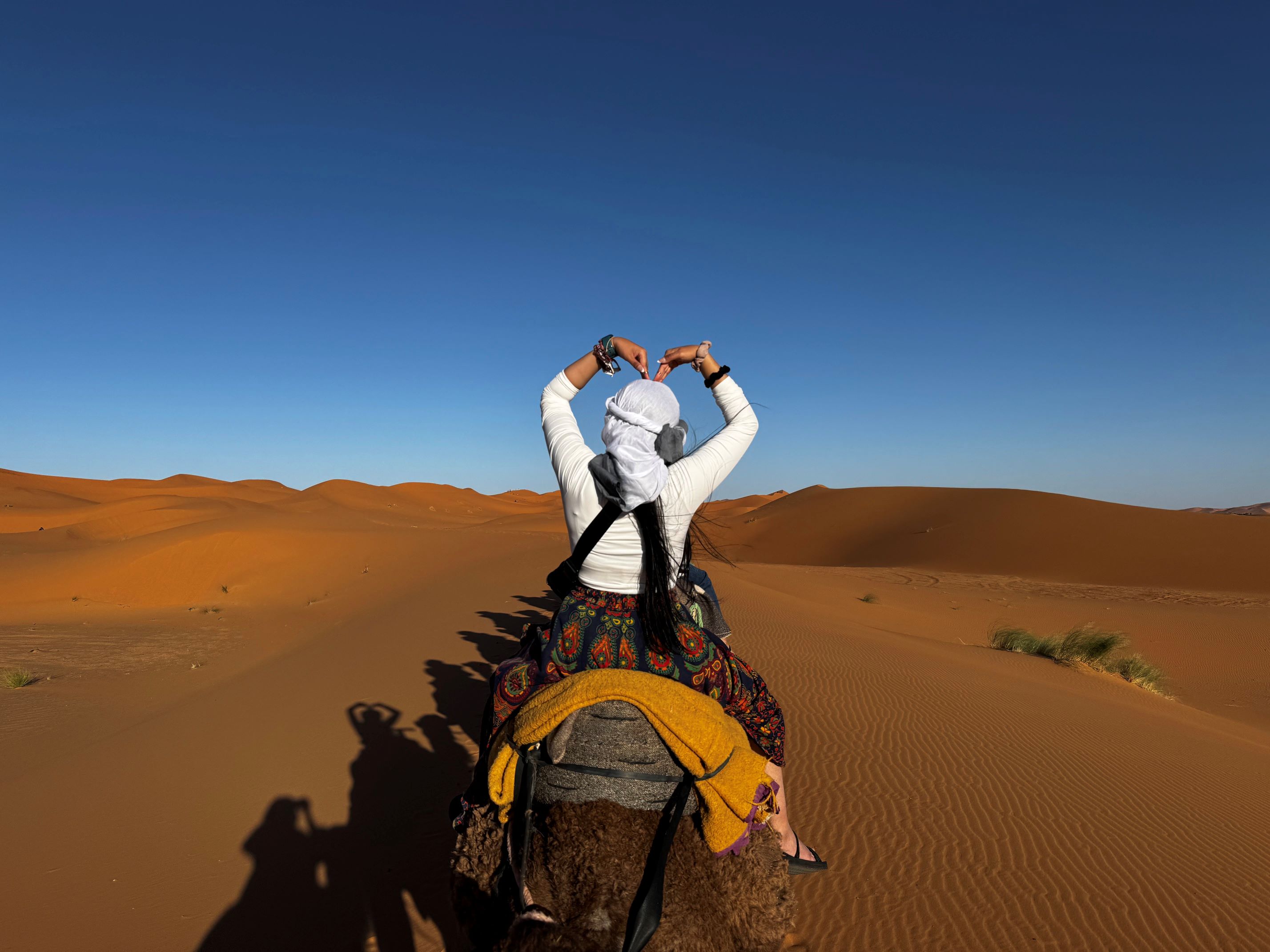 SAIT student rides a camel in the Sahara Desert, Morocco 2025