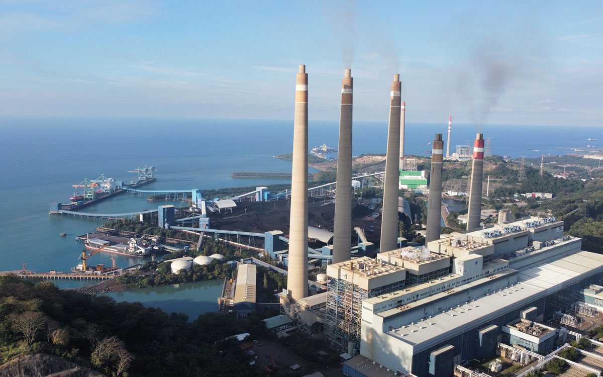 A steam power plant in Indonesia with a harbor view.Alt text goes here