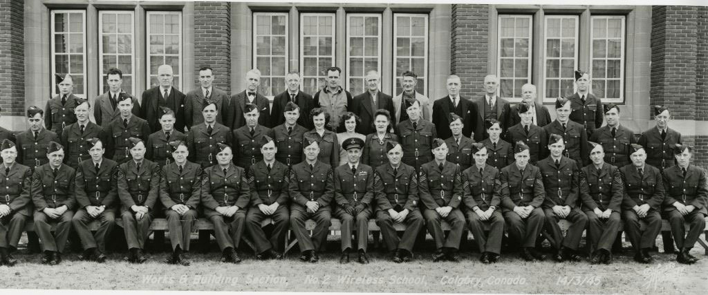 March 14, 1945, men and women of the No. 2 Wireless School pose for a photo outside the main building of the Provincial Institute of Technology and Art.