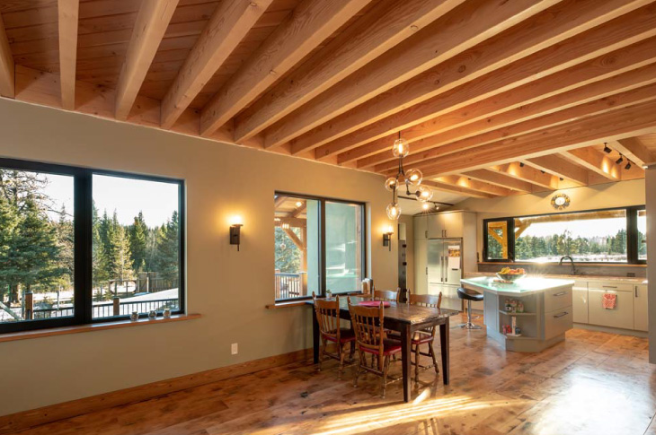 Stratifying roof joists represent the forest canopy, bringing nature indoors.