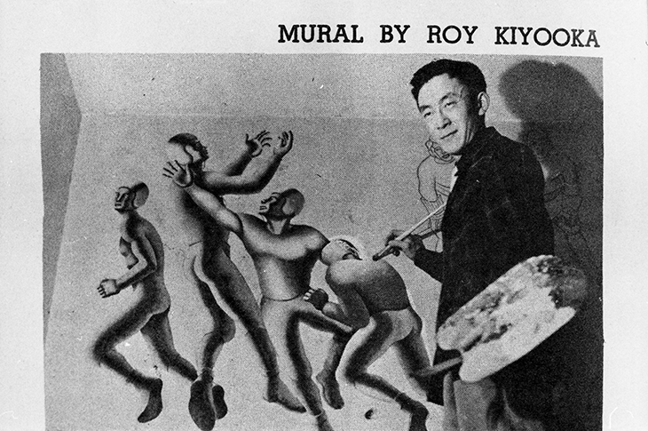 Vintage photo of Roy Kiyooka painting his mural "Sports at Tech"