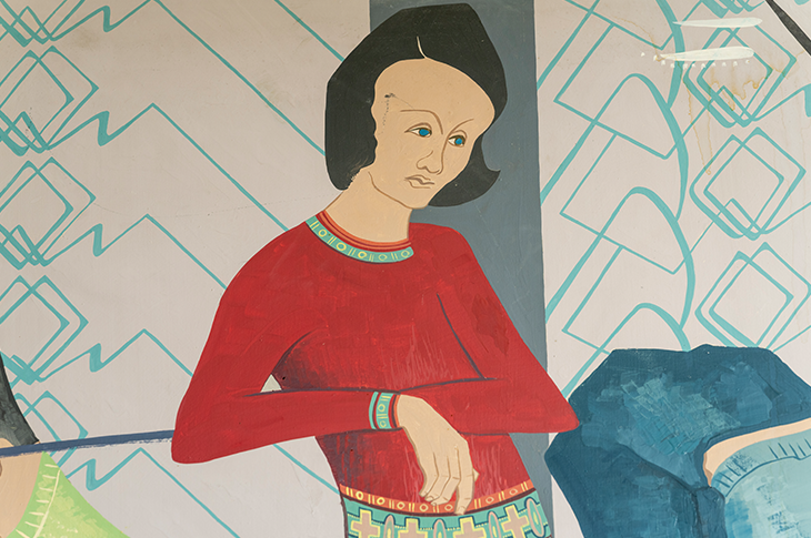 close up of woman or girl on mural in a red sweater
