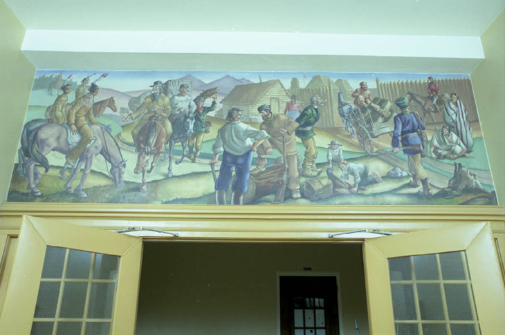 Mural created and completed by Ron (Gyo-zo) Spickett. This mural depicts pioneers and First Nations Peoples at a fort during the period of European exploration of Western Canada.