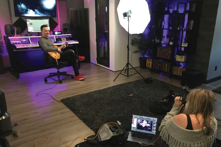 Ron Tarrant being shot by a photographer in a studio