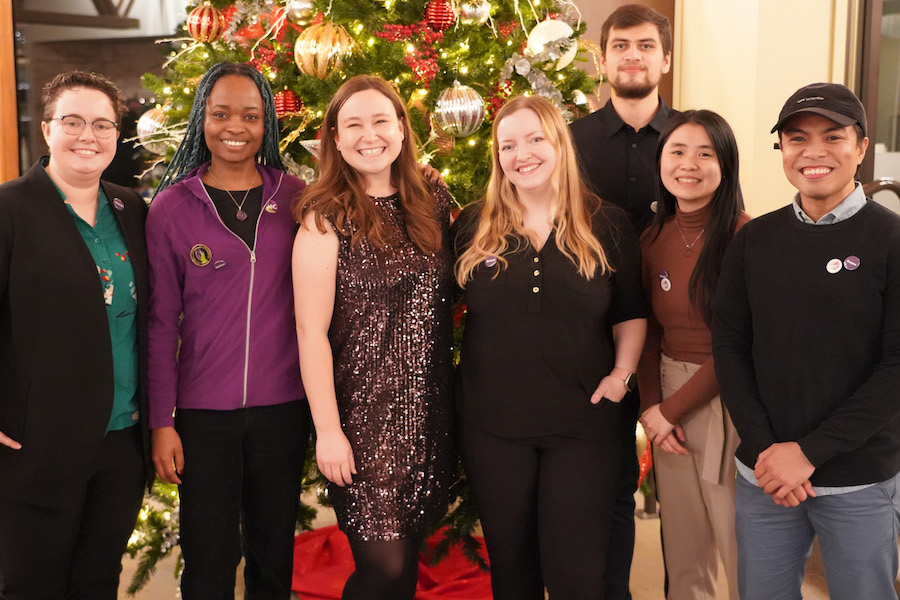 nw-group-of-students-stand-by-a-christmas-tree-900x600.jpg