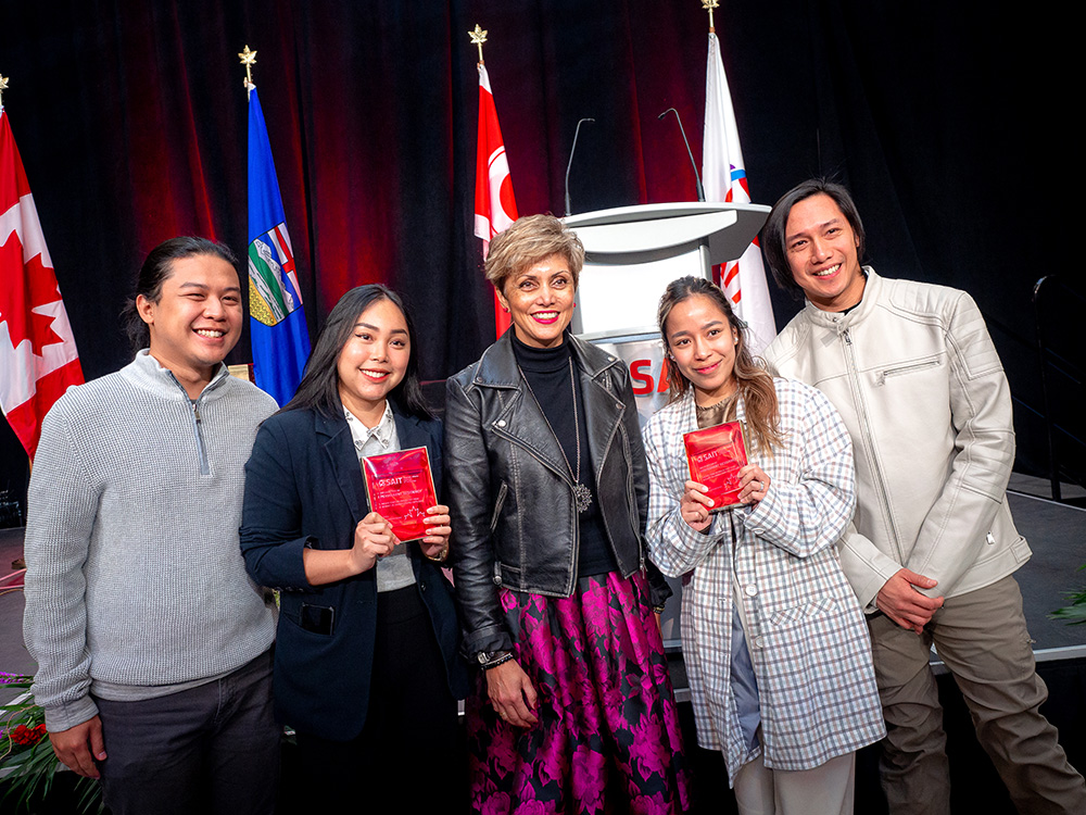 Calgary Mayor Jyoti Gondek takes a photo with SAIT international alumni