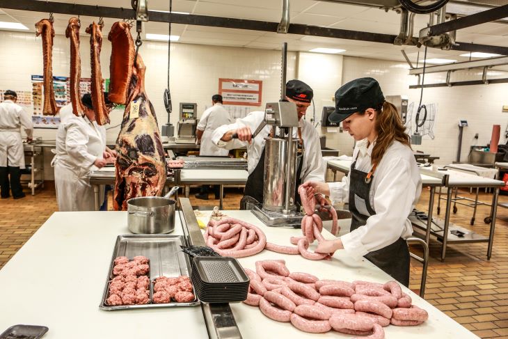 Students making sausage in the SAIT butchery