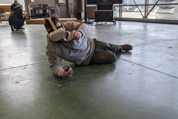 A Plumber and Gasfitter student “fixes” a furnace in SkillMill Simulation training using a virtual reality headset in TU103, Thomas Riley building (The Founding Builder’s House Lab and home of the AECOO Connector initiative).