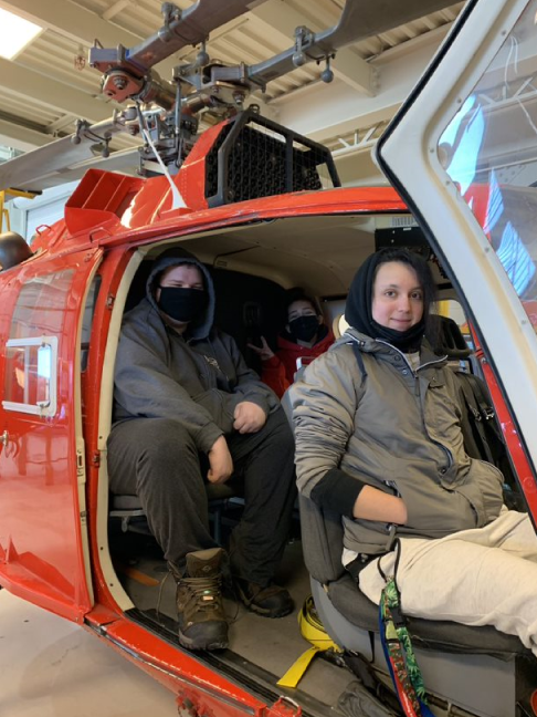 Students sitting in helicopter