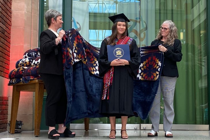 Indigenous grad being honoured with blanket ceremony