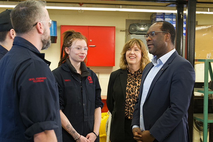 Heather Magotiaux, SAIT Vice President, External Relations, and Kaycee Madu, Minister of Skilled Trades and Professions, talk with SAIT apprentices.