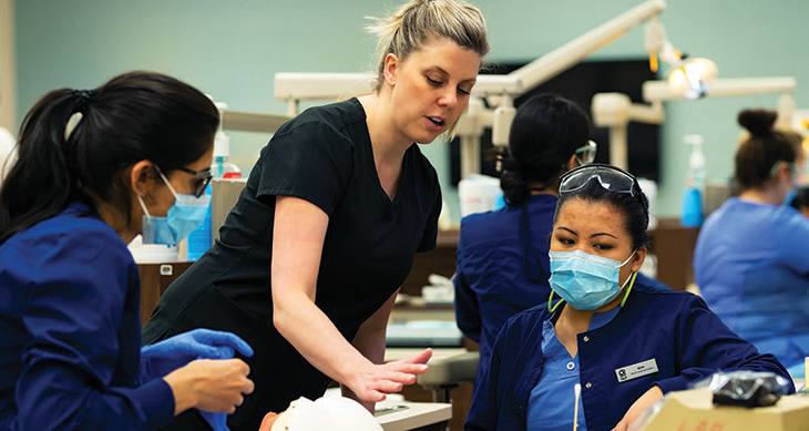 Instructor teaching dental assisting students in the classroom