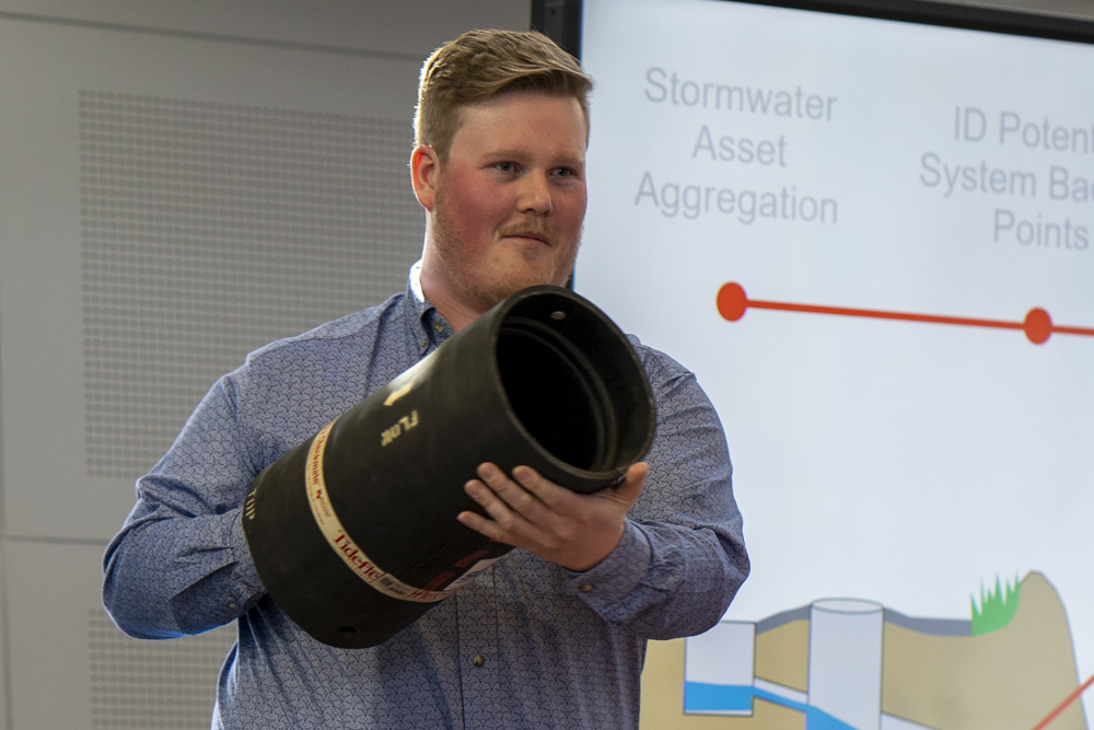 Dawson Smethurst holding up an example of a valve