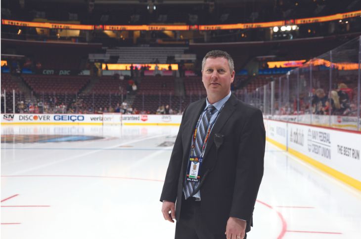 Mike Craig in a suit on the ice surface at the All Stars weekend